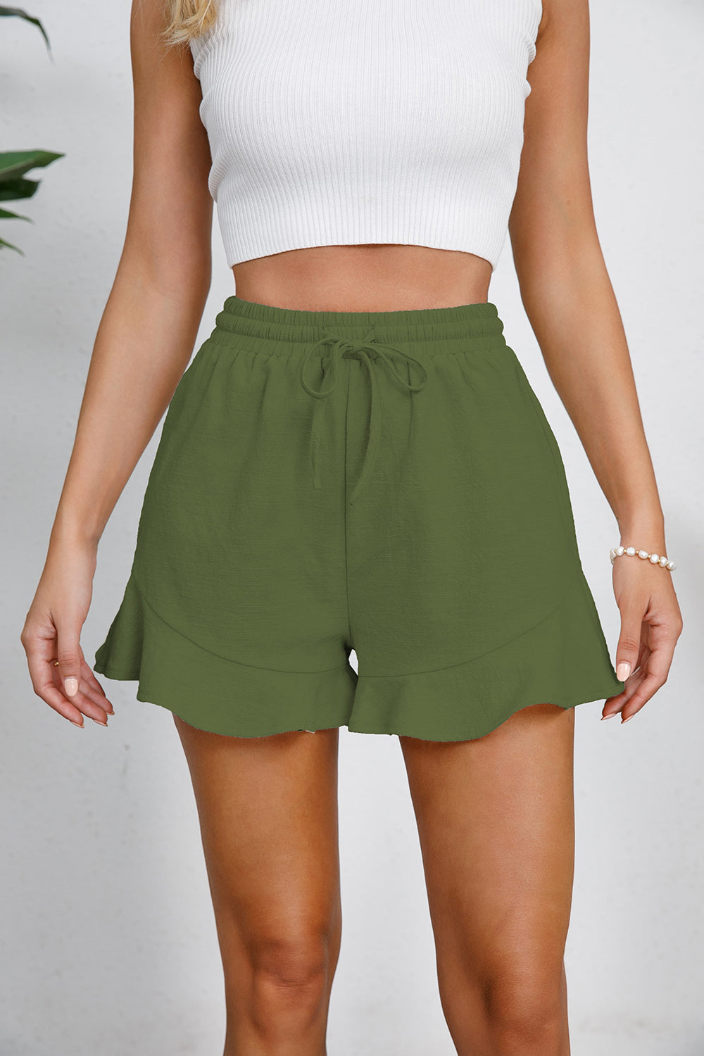 Full Size Drawstring Ruffle Hem Shorts Features: Ruffled, Drawstring Sheer: Opaque Material composition: 100% cotton Care instructions: Machine wash cold. Tumble dry low. Imported, ships in 5-10 business days Size US Bottom Length Waist HIP S 4 13.8 25.2